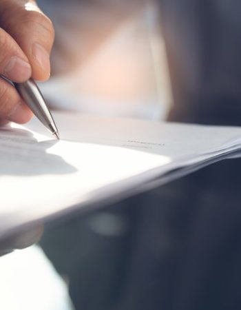 businessman-signing-business-contract-office_158043-43